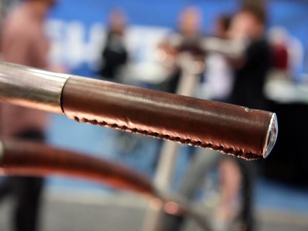 The stitched leather grips on Naked's city bike maintain a constant outer diameter with the rest of the handlebar.