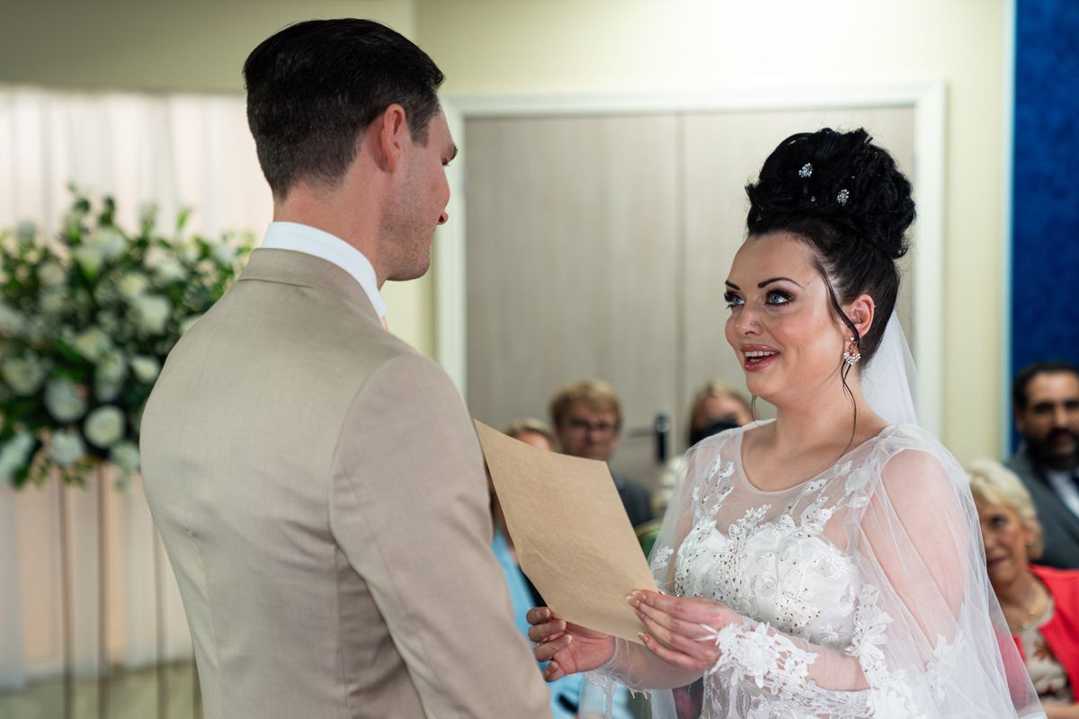 Zack Hudson and Whitney Dean about to say their marriage vows in the wedding venue