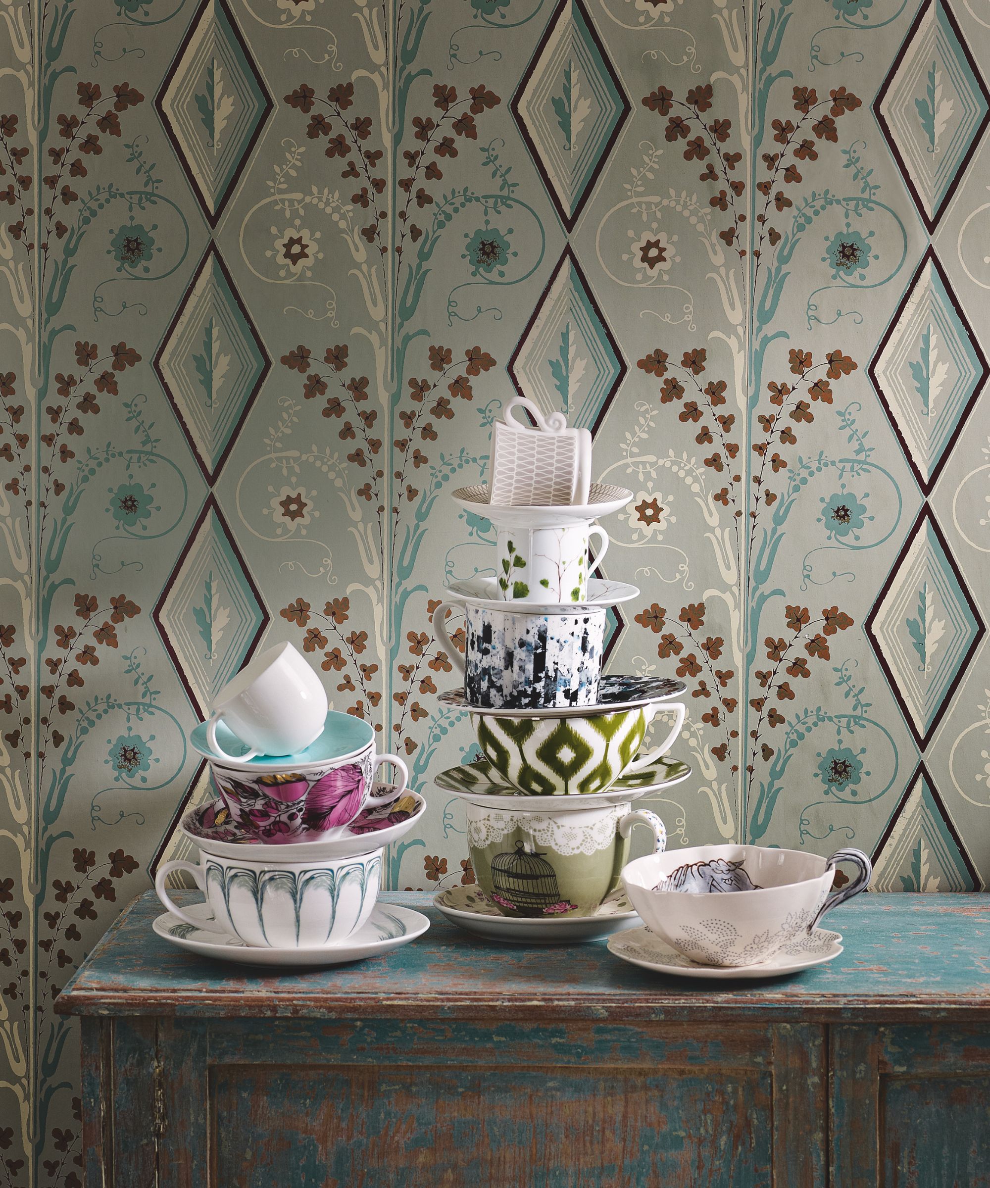 Patterned tea cups on rustic wood sideboard