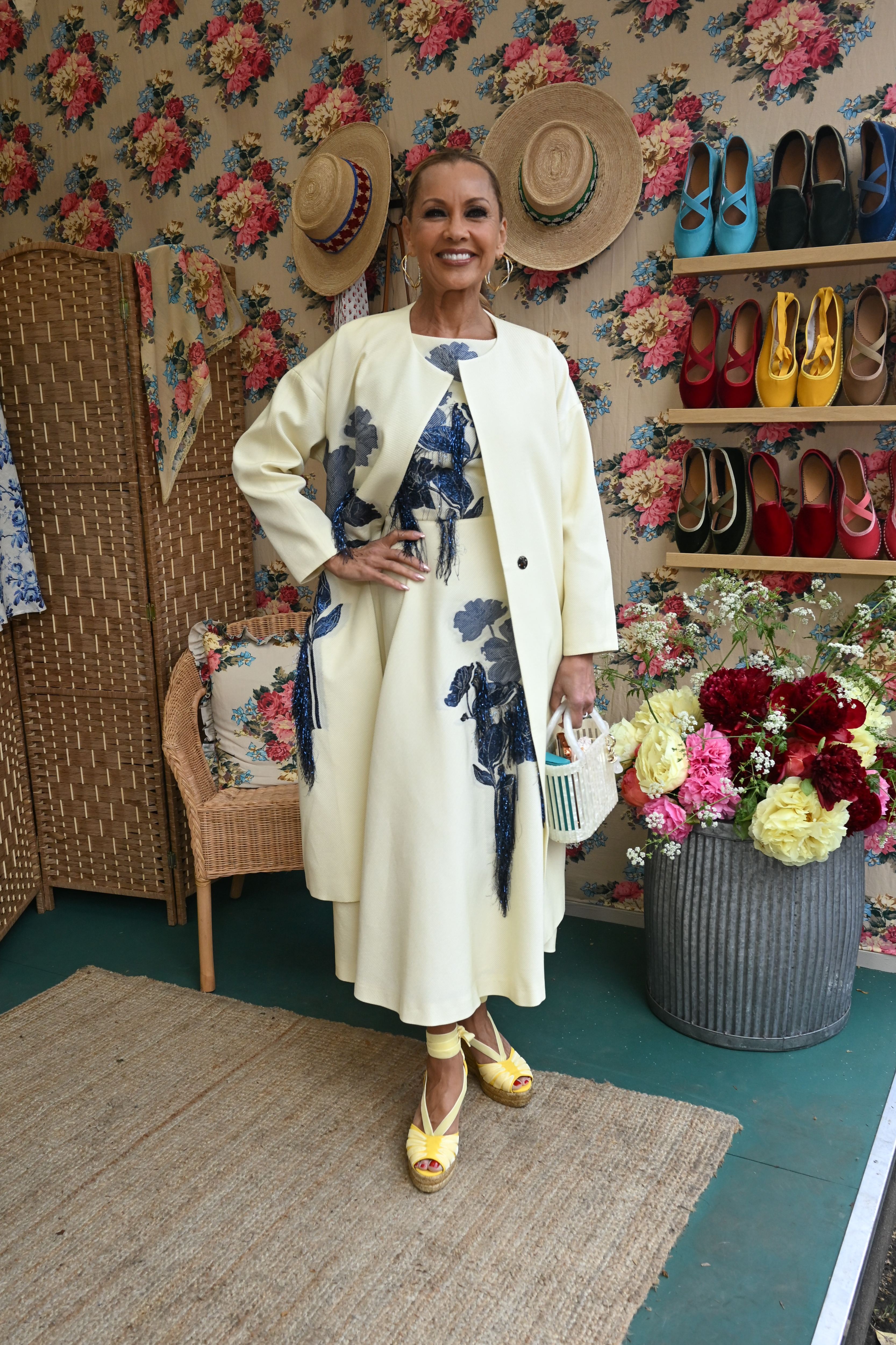 Vanessa Williams wearing a cream and blue outfit