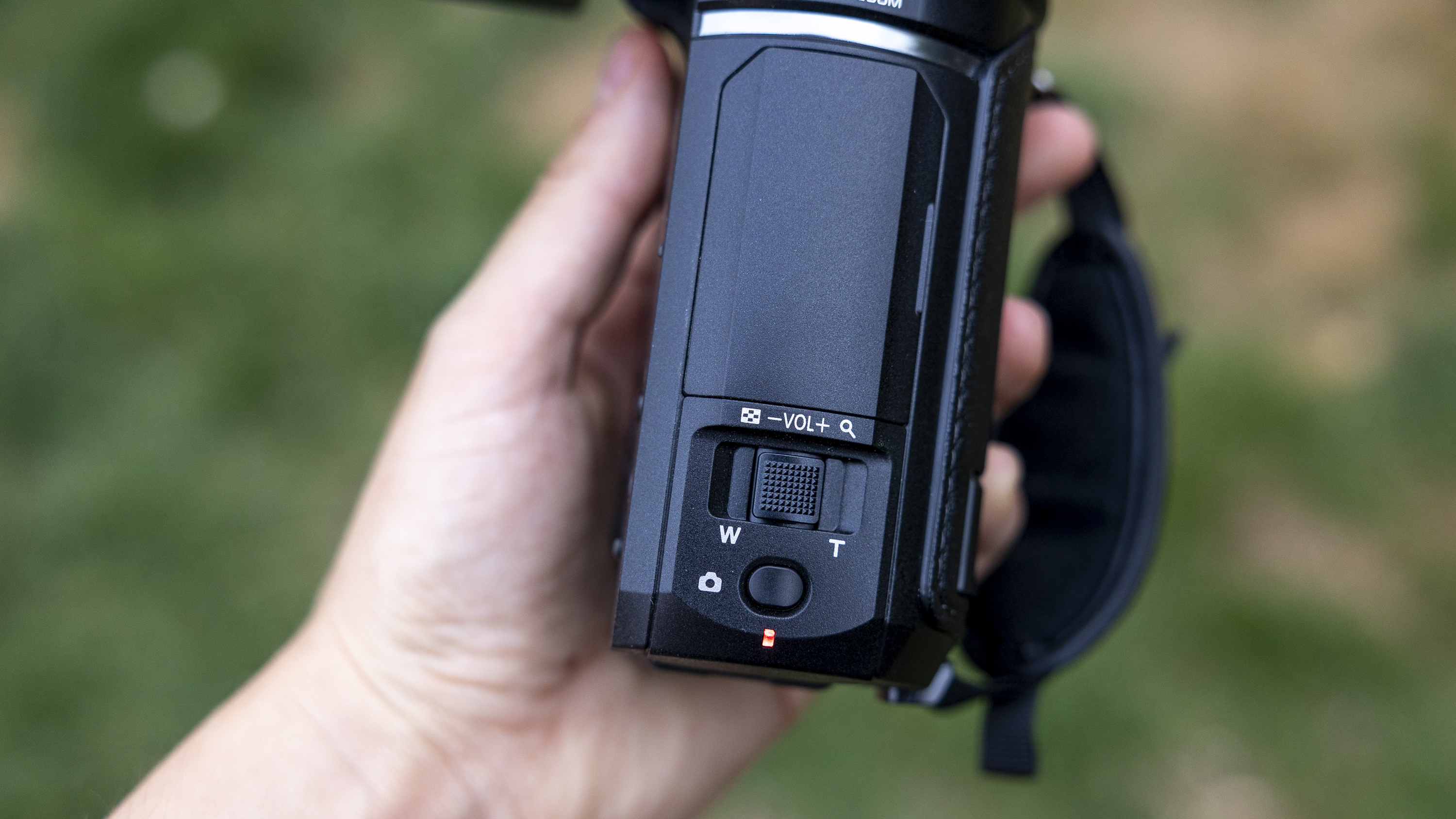 A close-up of the zoom function on top of the Panasonic HC-V900 camcorder