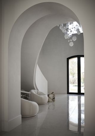 modern minimalist spacious entryway with seating