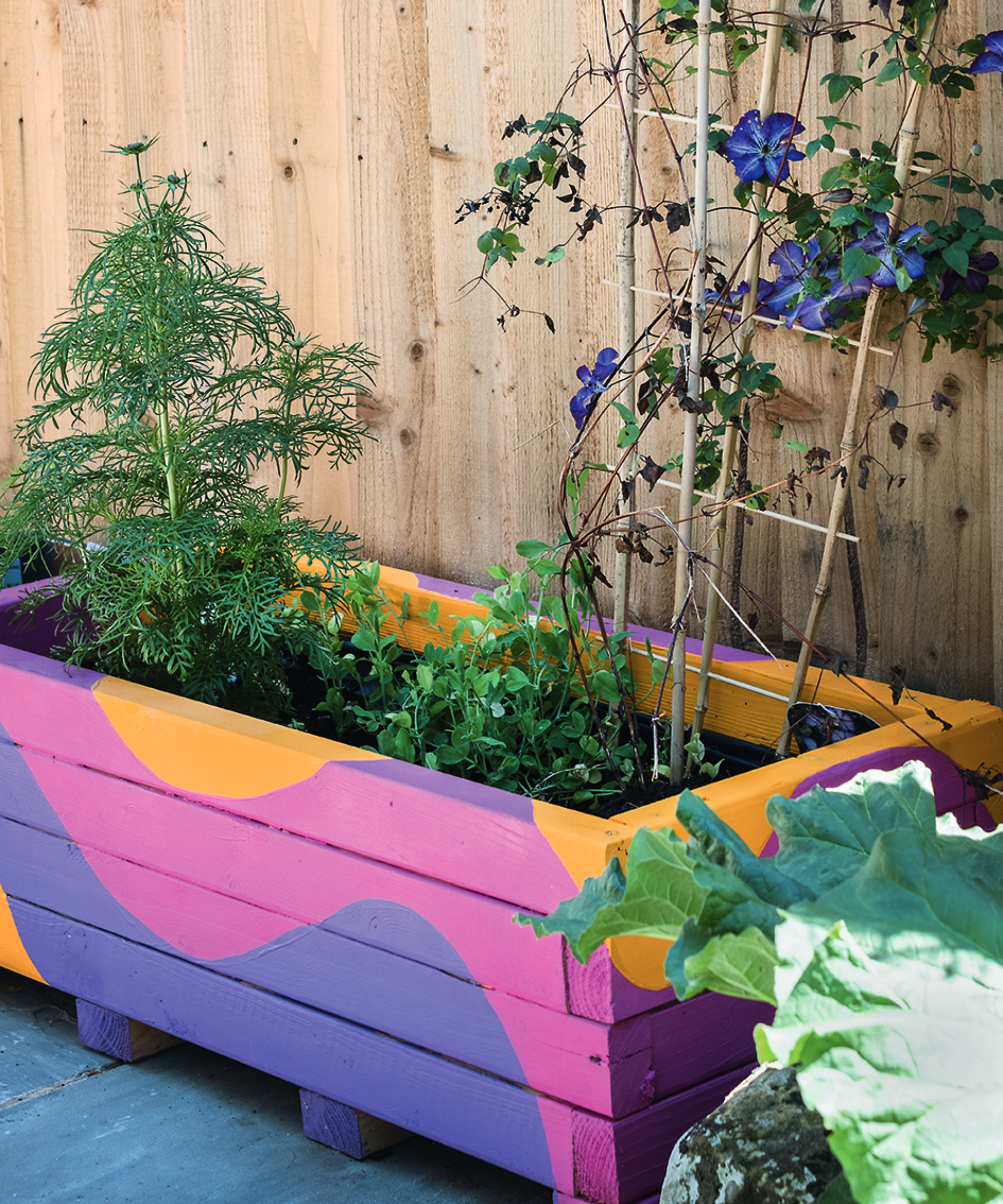 painted wooden planter in garden
