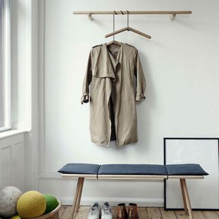 room with white wall and wooden floor and scandi living hanger