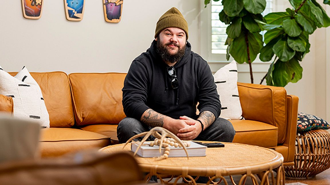 Bear Walker and Pokémon; a man sits on a yellow sofa