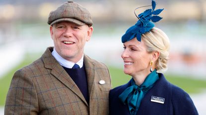 Mike Tindall and Zara Tindall smile for photos as they attend day 1 'Champion Day' of the Cheltenham Festival 