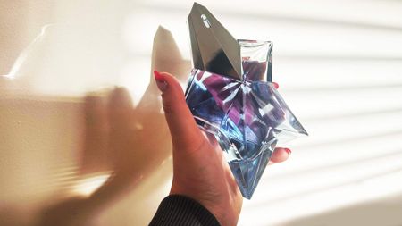 Tori holding Mugler Angel