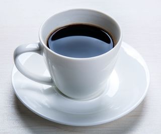 A cup of coffee on a white table