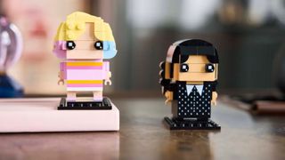 Lego Enid & Wednesday models on a table