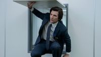 Adam Scott's Mark exiting from a small square door in Severance Season 2 episode 3 "Who Is Alive?"