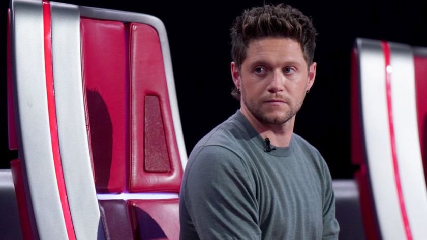 Niall Horan looks to the side from his Big Red Chair on The Voice Season 28.