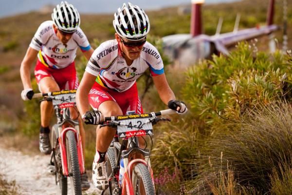 Burry Stander and CHristoph Sauser summit Honing Klip during stage seven of the 2010 Absa Cape Epic Mountain Bike stage race held in and around Oak Valley in the Western Cape, South Africa.