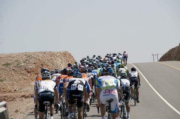 The peloton crests a roller during the third stage of the Tour of Oman.