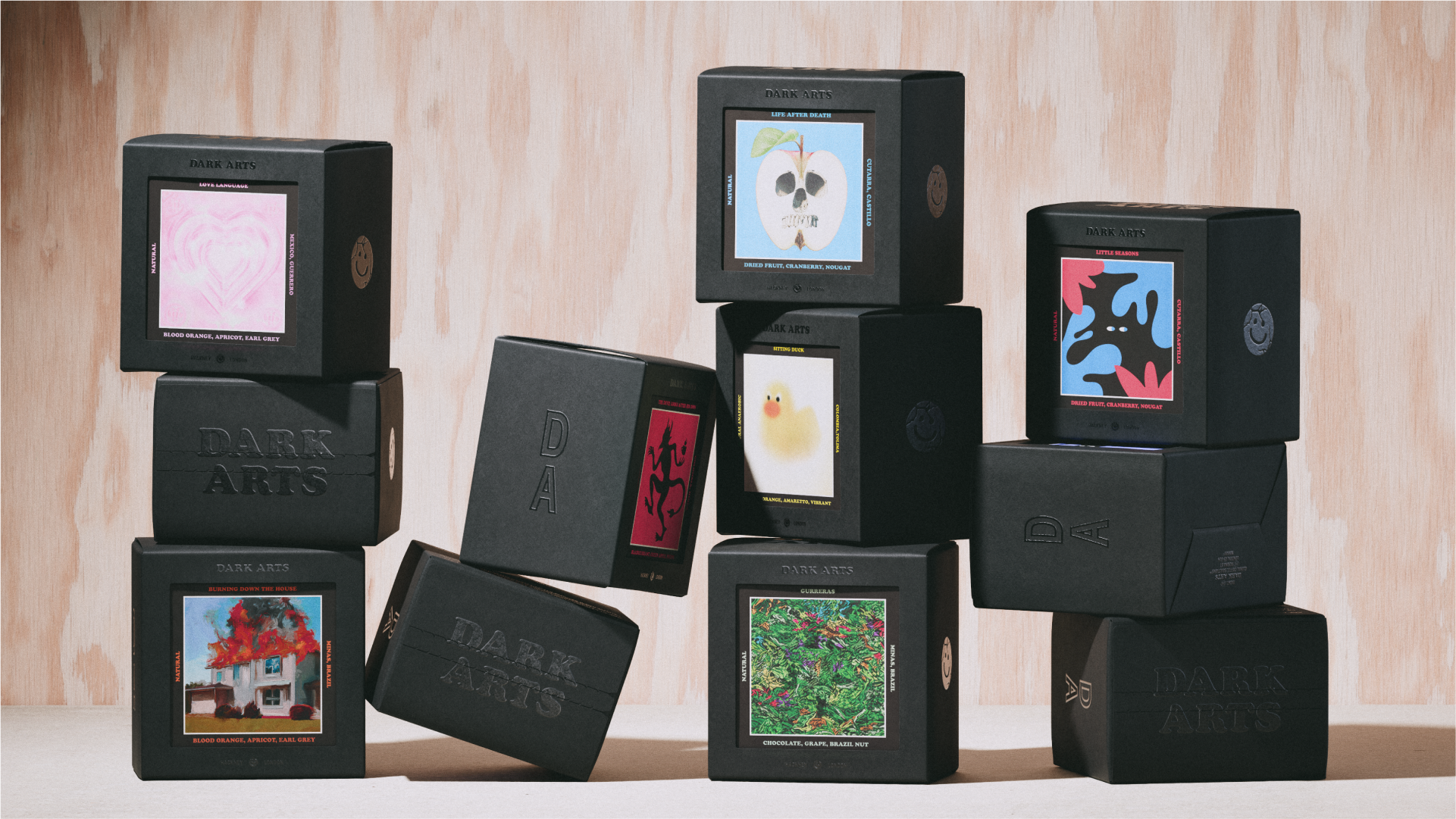 boxes in black with pictures on piled on top of each other