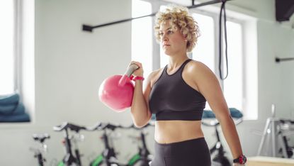 Woman doing a kettlebell workout