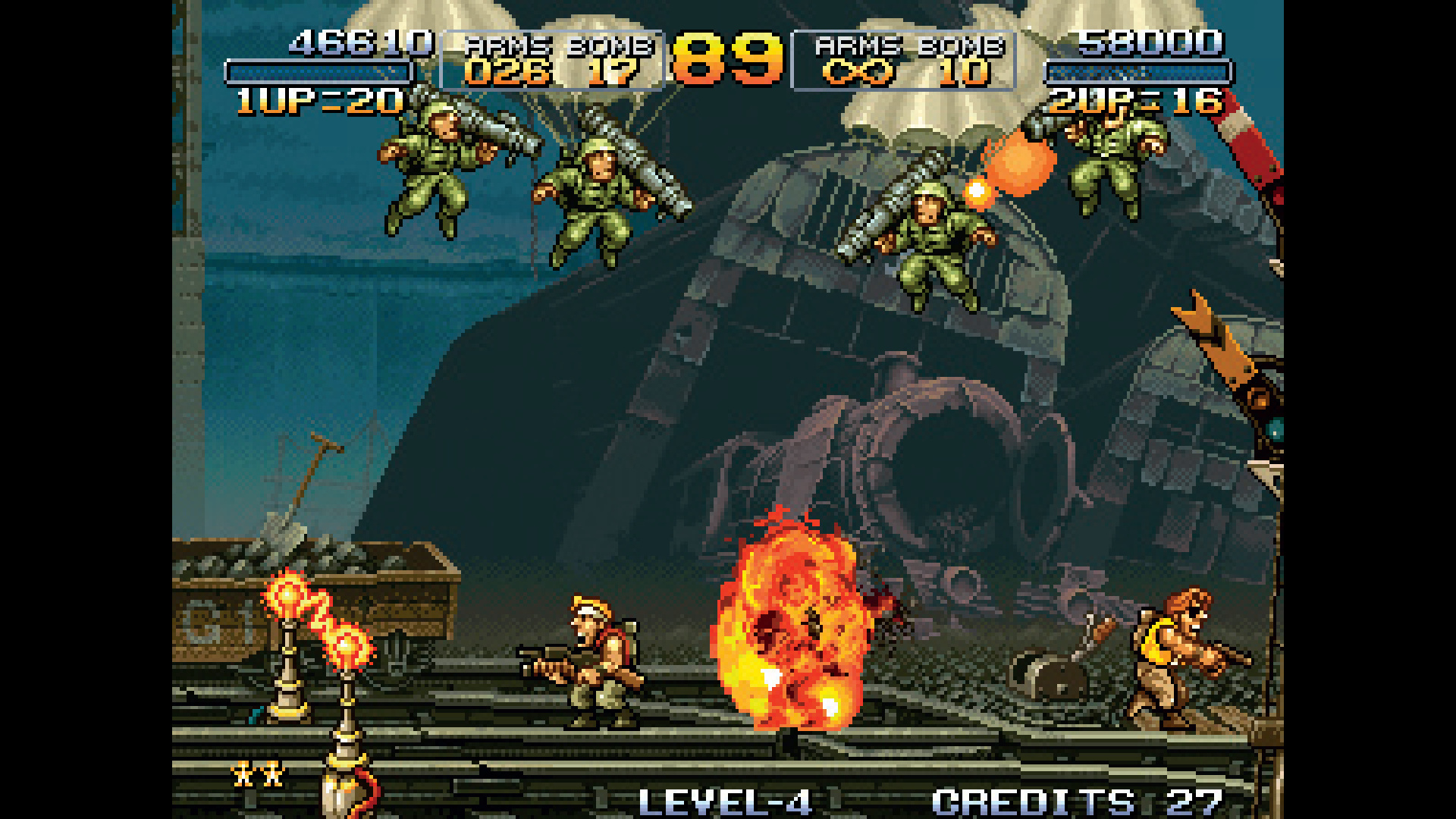 Enemies parachute towards players as one is on fire in Metal Slug, from Retro Gamer #98