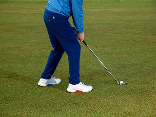 Golf Monthly Top 50 Coach Dan Grieve demonstrating a drill to prevent heavy iron strikes