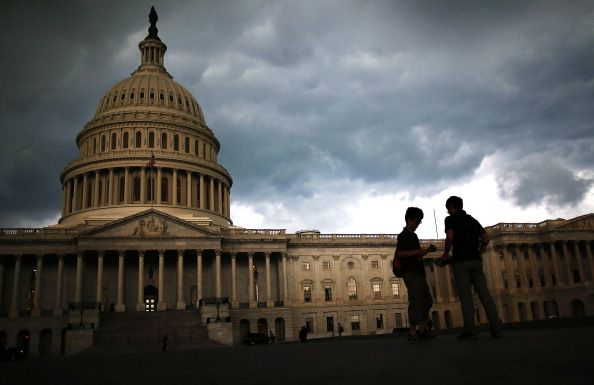 Two men standing outside the U.S. Capitol building.