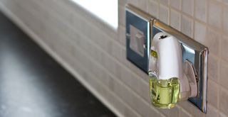 A plug in air freshener in the kitchen to show how to make your house smell great at all times
