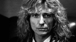 David COverdale of Whitesnake in suit and tie in 1990