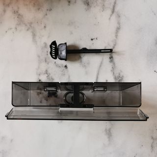 The Breville Barista Signature Espresso Machine's accessories on a grey marble work surface