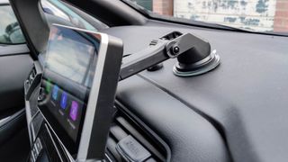 Intellidash+ shown from side angle, mounted on a car dashboard