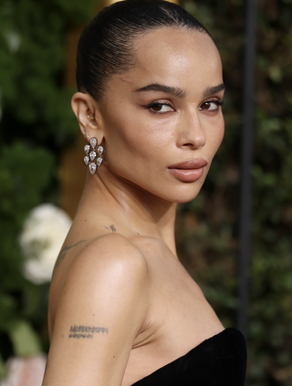 Zoë Kravitz attends the 82nd Annual Golden Globe Awards at The Beverly Hilton on January 05, 2025 in Beverly Hills, California wearing diamond earrings from her engagement ring designer jessica mccormack