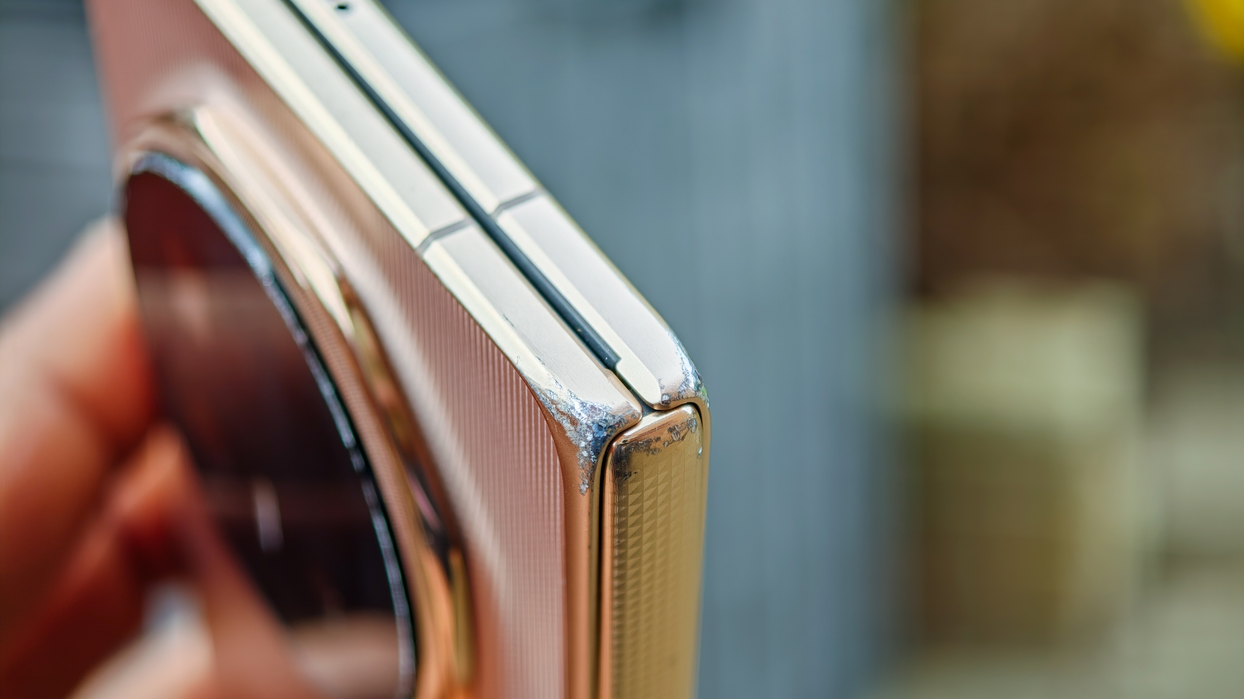 The Honor Magic V6 in gold after being put through a washing machine, complete with scratches and blemishes but fully working. 