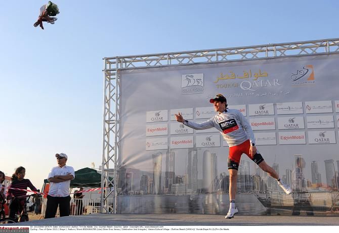 Brent Bookwalter (BMC) tosses the points jersey bouquet in the 2013 Tour of Qatar