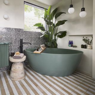 Ca'Pietra striped tiles and green bath