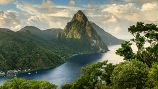 Stunning view of the Pitons (Petit Piton & Gros Piton) from an elevated viewpoint with the rainforest and bay of Soufrière in the foreground