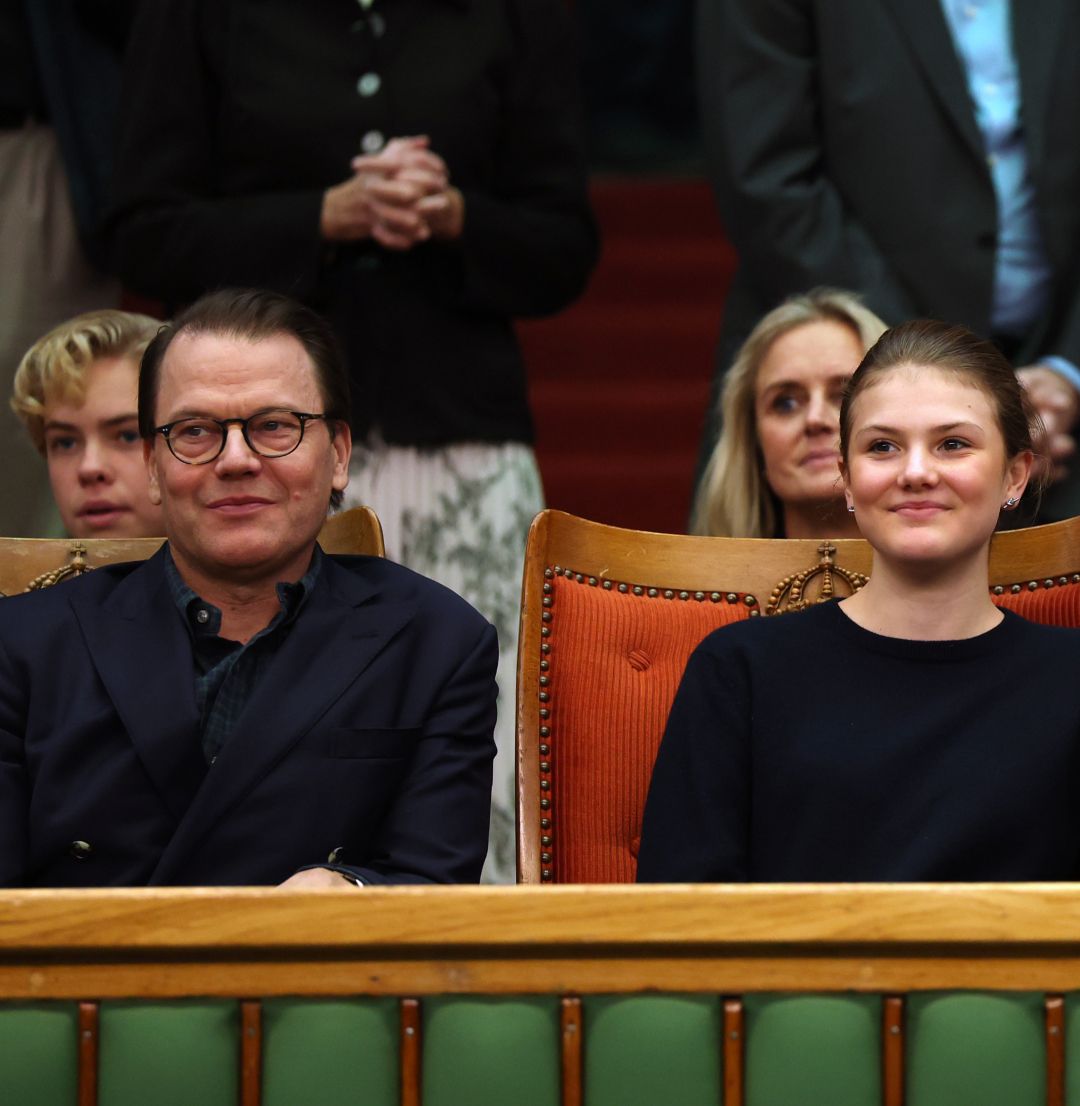 Princess Estelle and Prince Daniel sitting next to each other watching a tennis match