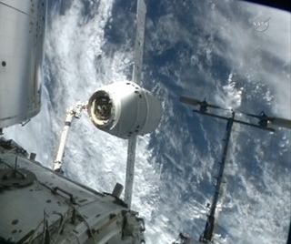 SpaceX Dragon capsule aligns with docking port on the International Space Station.