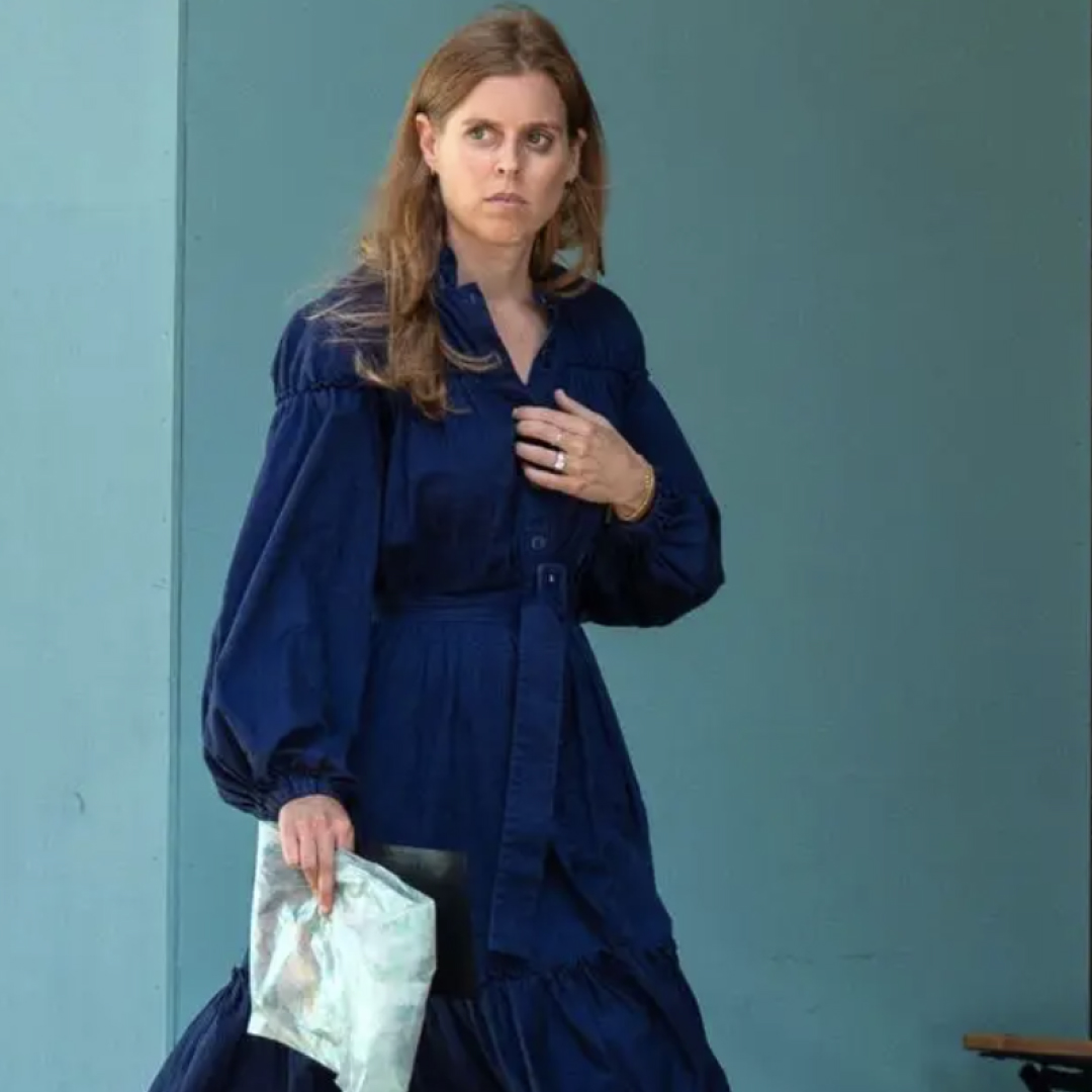 Princess Beatrice walking in a blue dress