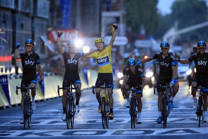 Team Sky on a victory lap in Paris having secured Chris Froome's win