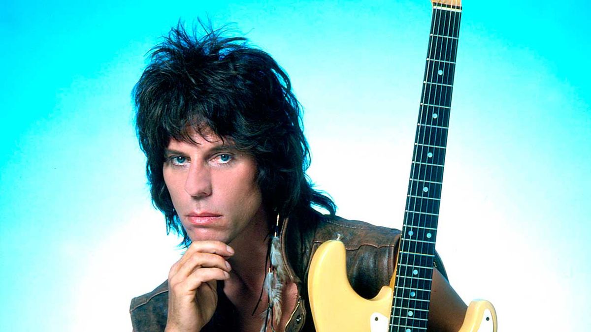 Jeff Beck studio portrait holding guitar