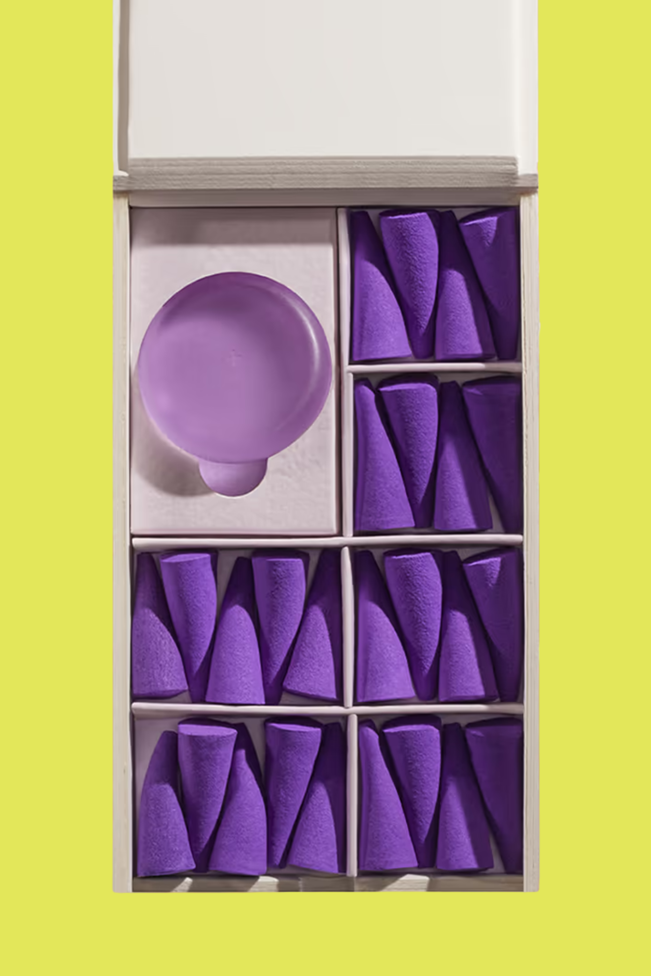 A box of purple incense droplets with a purple seaglass holder