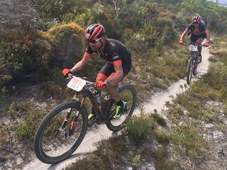 Cadel Evans and George Hincapie compete in the 2017 Cape Epic MTB race,