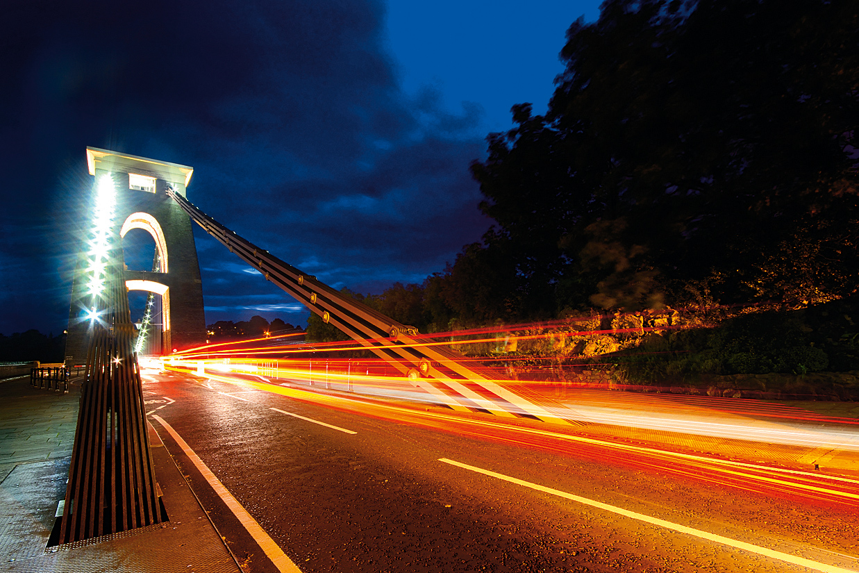 Turn moving traffic into artistic light trails using long exposures after dark
