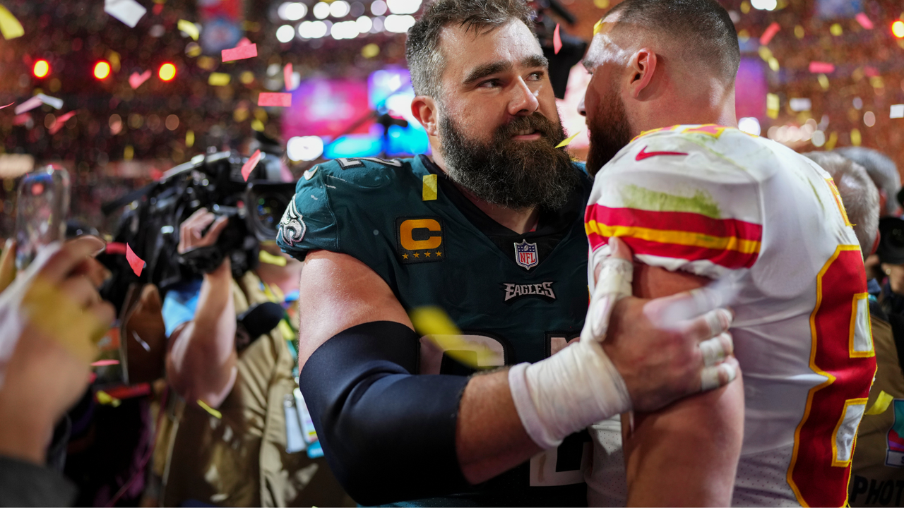 Jason Kelce #62 of the Philadelphia Eagles speaks with Travis Kelce #87 of the Kansas City Chiefs after Super Bowl LVII at State Farm Stadium on February 12, 2023 in Glendale, Arizona. The Chiefs defeated the Eagles 38-35