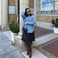 marina wars oversized denim shirt, polka dot skirt, and suede boots