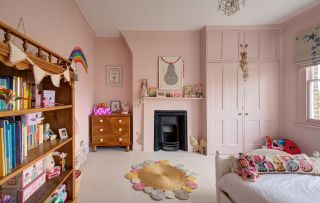 girls pink bedroom with bed and wardbrobe