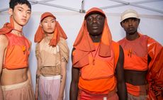 Cottweiler S/S 2018 models backstage wearing different orange outfits