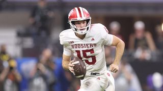 Indiana Hoosiers quarterback and Heisman Trophy winner Fernando Mendoza running with the ball