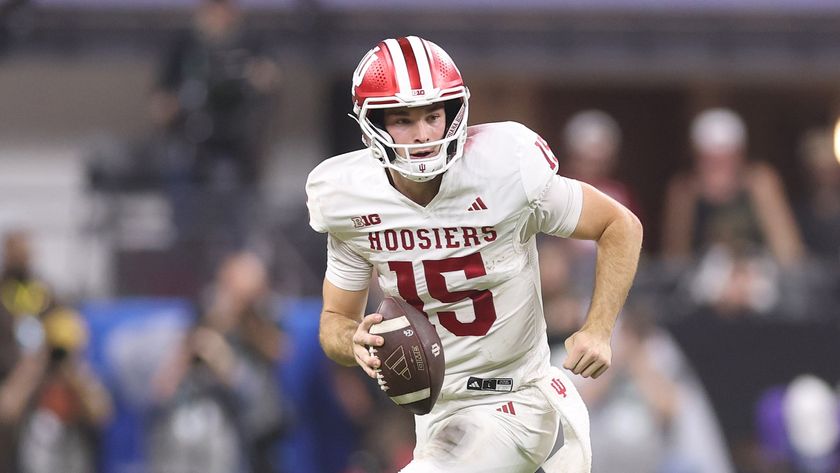 Indiana Hoosiers quarterback and Heisman Trophy winner Fernando Mendoza running with the ball