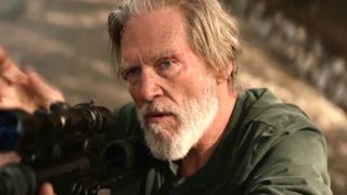 Jeff Bridges holding a gun in The Old Man