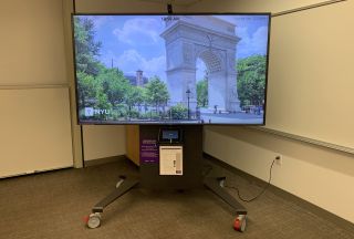 The team standardized its Zoom deployment with mobile carts from Legrand equipped with 86-inch LG displays, Huddly cameras, and Crestron Mercury conferencing units.
