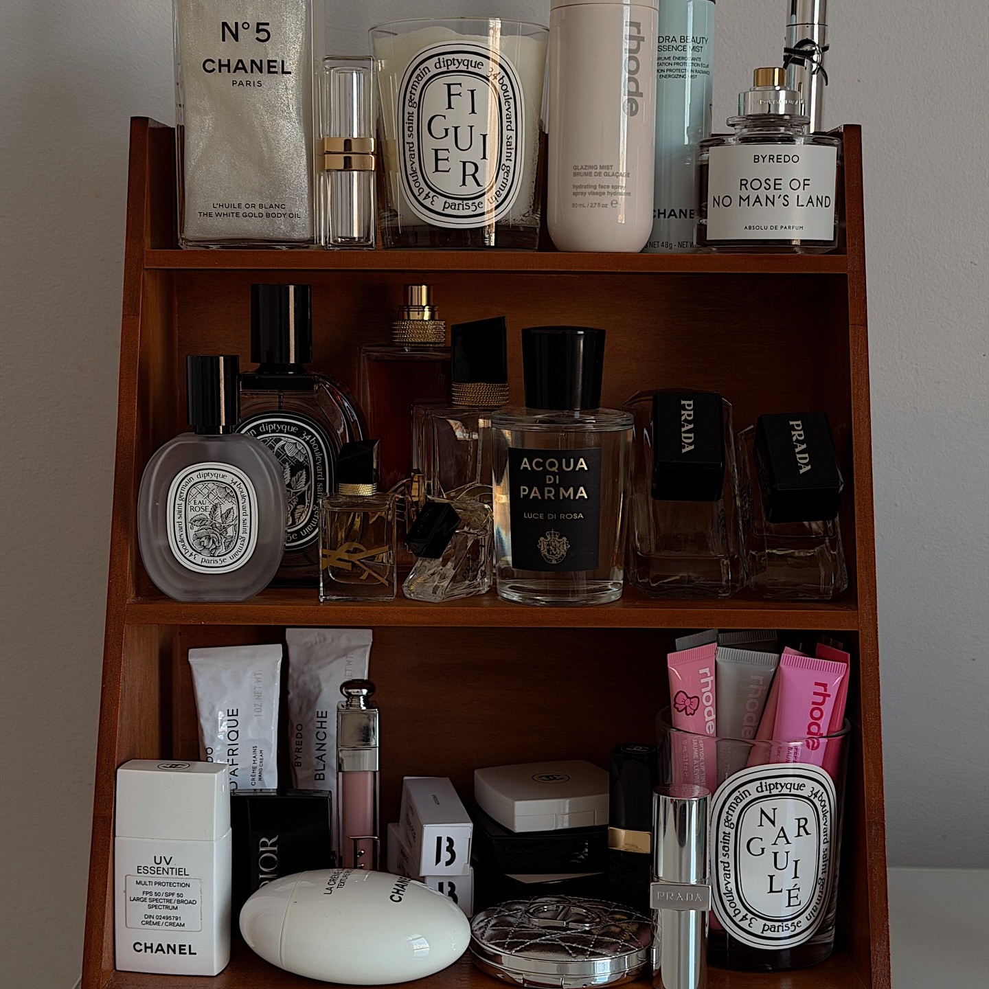 Photo of perfumes and skincare products on a vanity