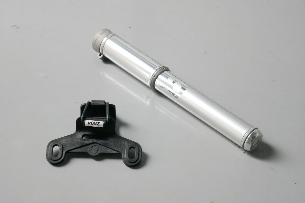 Best bike mini pumps group test 2026 - Bontrager Air Support in silver set to a grey background with its bottle cage mount