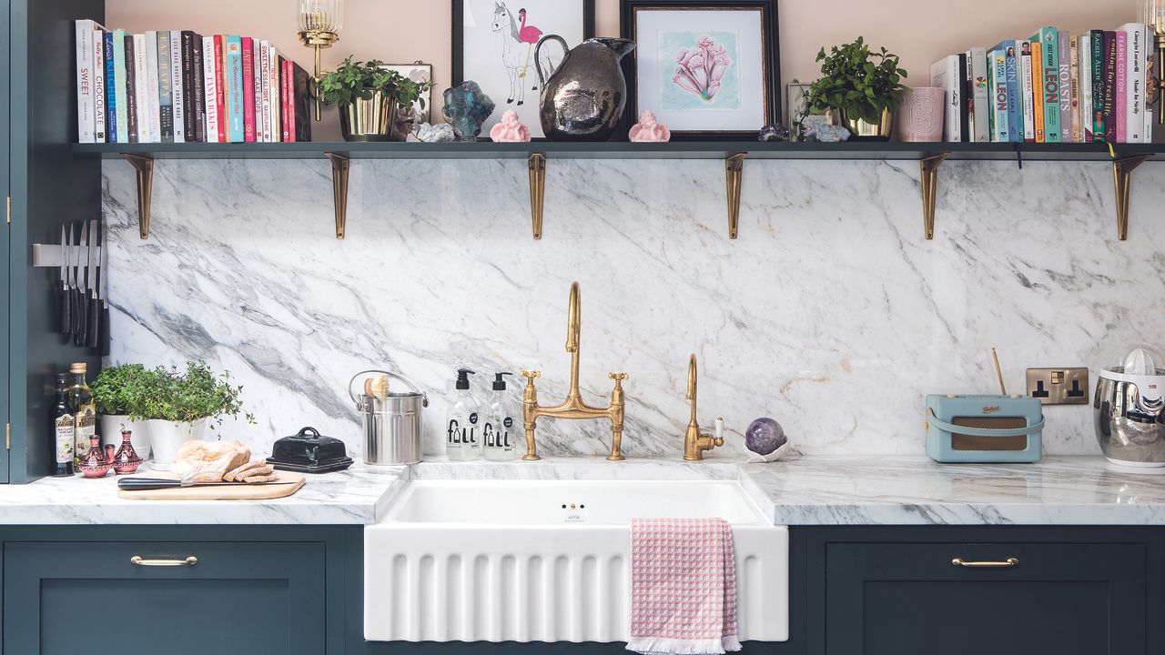 Fluted white Belfast sink in navy kitchen with open shelving